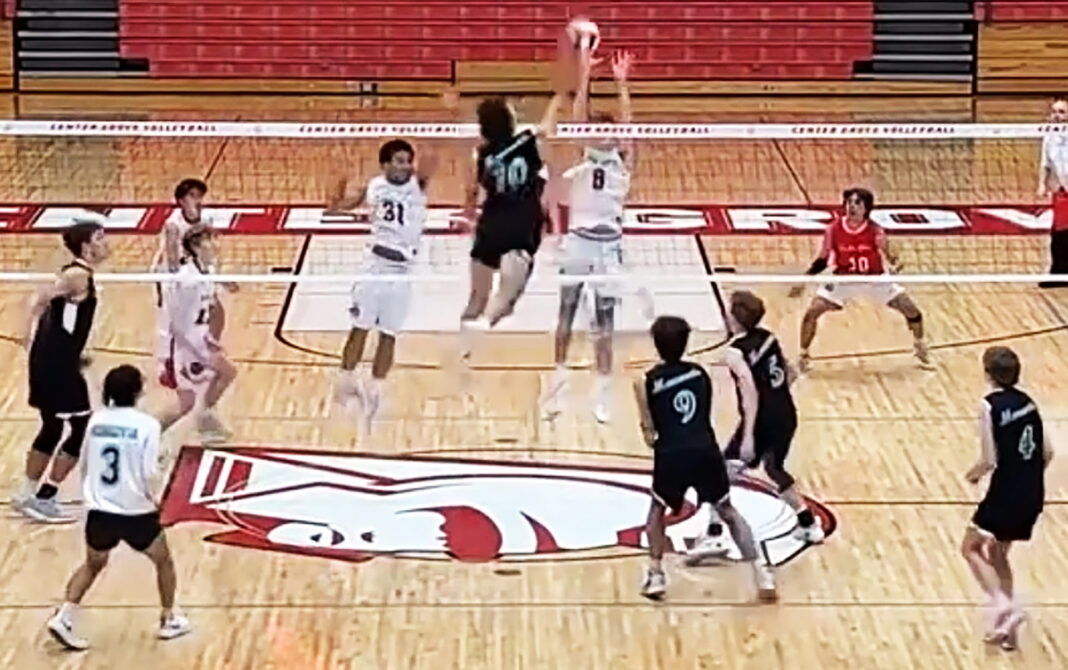 Bulldog boys battle, but Trojans prevail